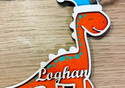 Suspension de Noël : Dinosaure Père Noël pour Loghan